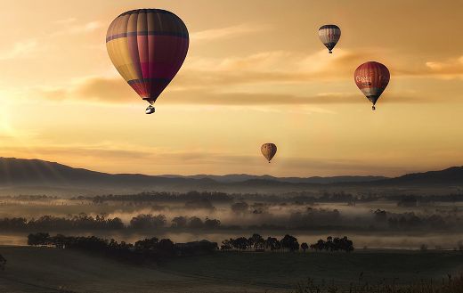 Air balloons sunset field