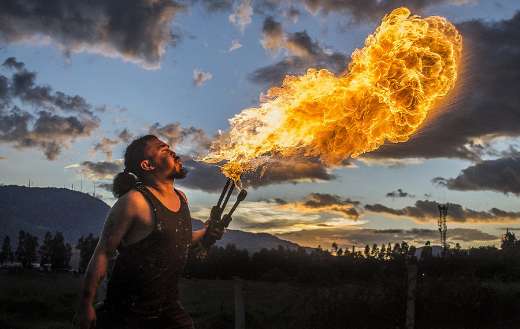 Man blowing fire online