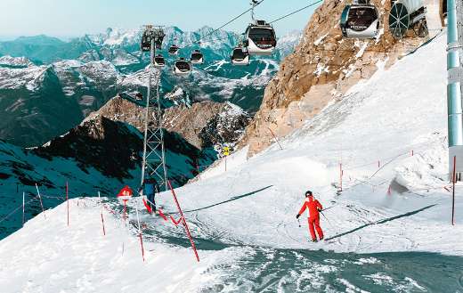 high angle people skiing snow capped mountain