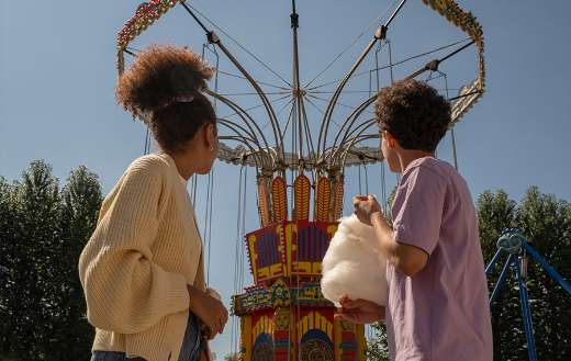 Couple looking big carousel puzzle