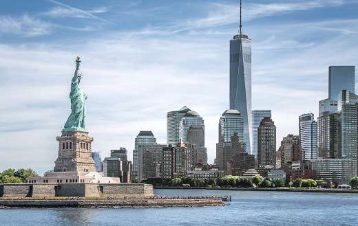 Statue of liberty with one world trade center background