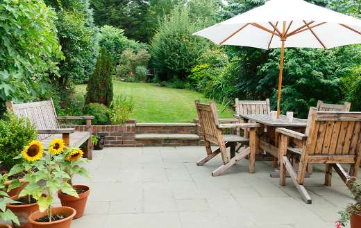 Terrace with garden furniture and parasol
