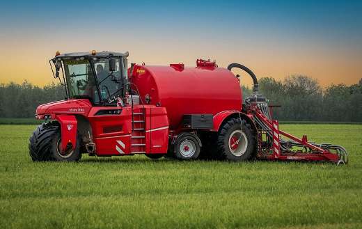 Red farmer machinery field tillage