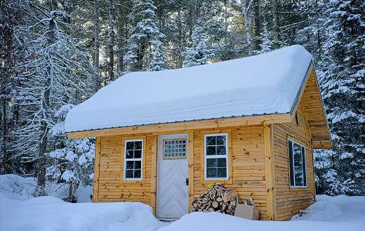 Snow covered wooden house