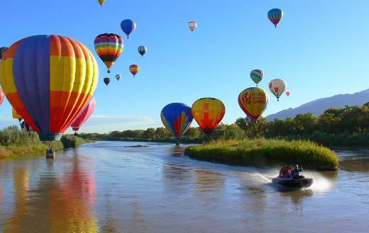 Hot air balloons lake sides