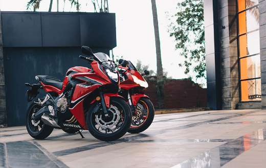 Parked red and black sport motorcycles