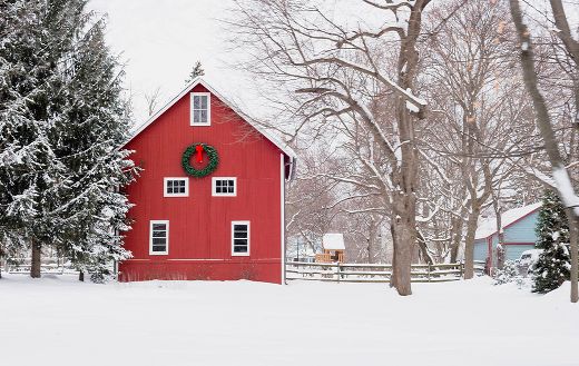 Red barn with Christmas wreath snowy midwestern day