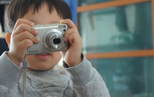 Boy learning play camera