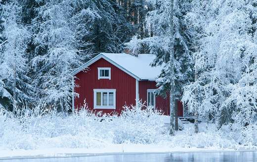 Winter time red sauna cottage