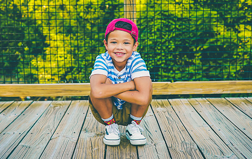 Boy on wooden porch