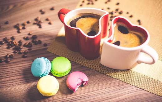 Black coffee with colorful macaroons