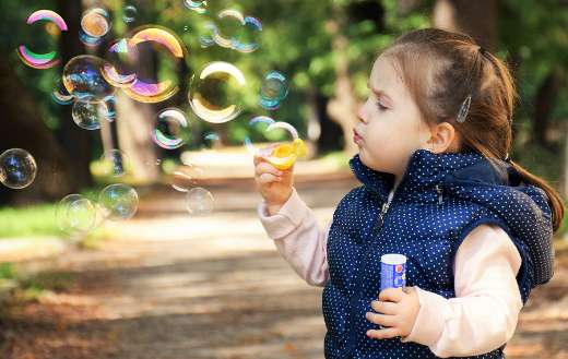 Soap bubbles child joy play