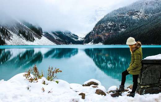 Adventure female hiker in a beatiful lake
