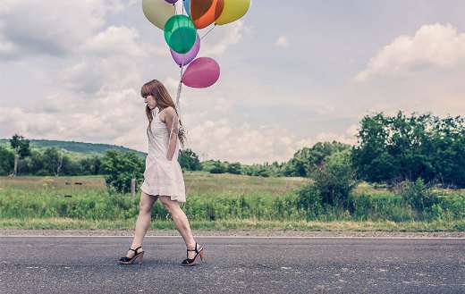 Woman with balloons online