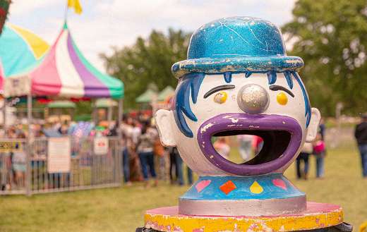 Clown face amusement ride