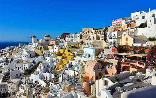 Santorini Grace view of the windmill at Oia castle