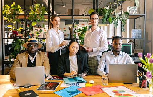 People in the office taking a group photo