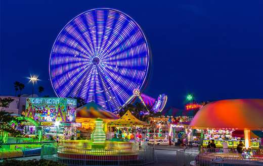 An amusement park at night online
