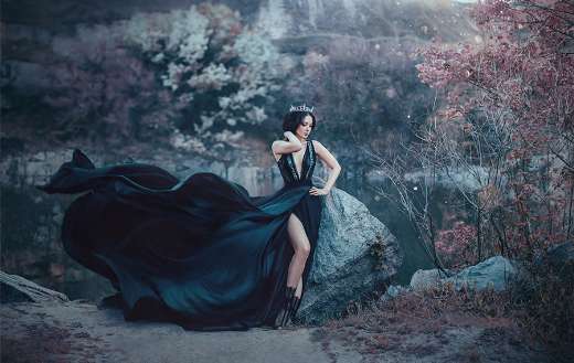 Dark queen pose gloomy rocks