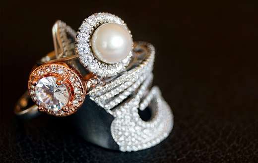 Silver colored ring clear gemstone white pearl