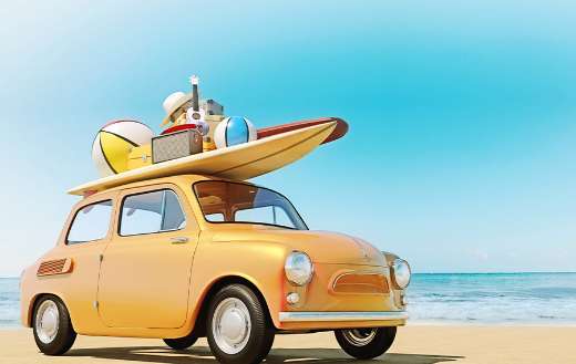 Small retro car with baggage beach equipment