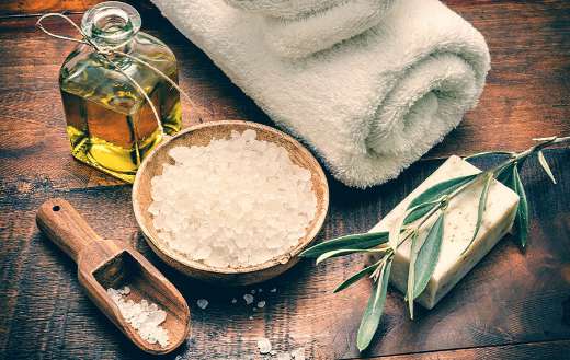 Spa setting with natural olive soap sea salt