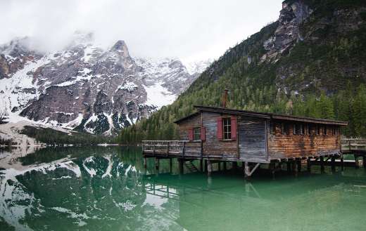 Abandoned wooden house lake