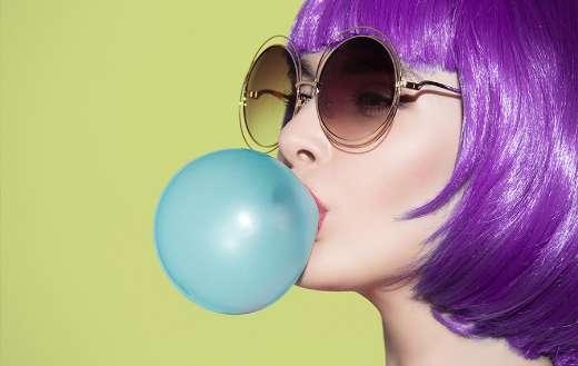 Pop art woman portrait wearing purple wig