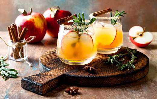 Smoky apple cider margarita fall cocktail with cinnamon rosemary star anise