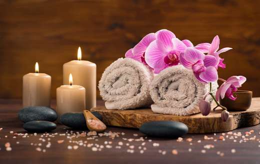 Spa setting with brown rolled towel
