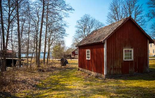 Spring in farm land Sweden old bar rural surroundings