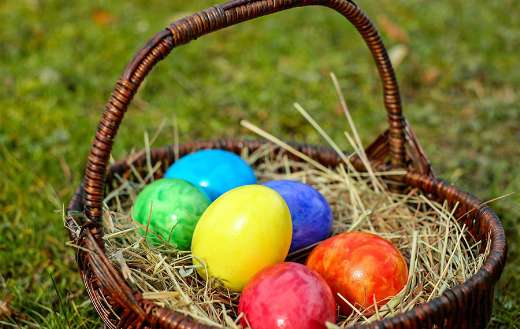 Colorful easter eggs in basket online