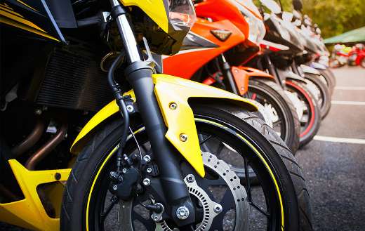 Motorcycle standing in the row