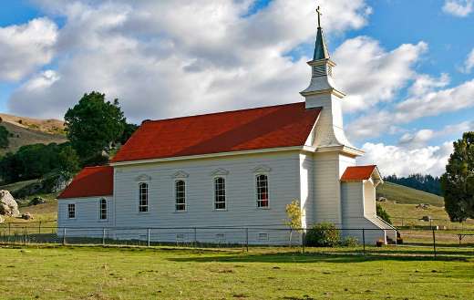 Church on green grass field