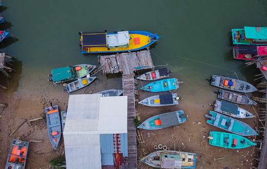 Boats docked on a seashore