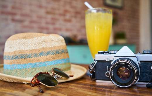 Hat black dslr and sun glasses