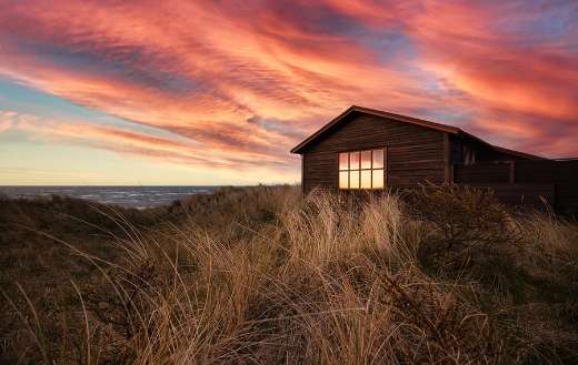 House cabin dunes at sunset