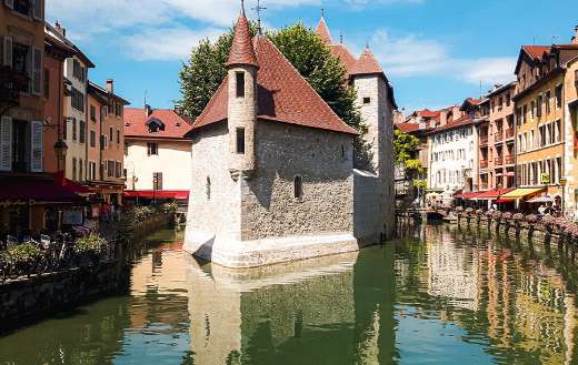 White and brown building near river
