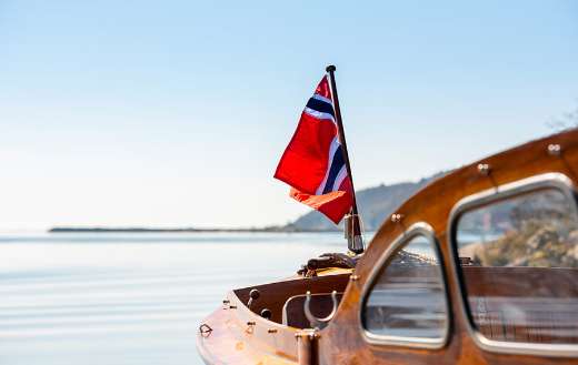 Norwegian flag rear mast wooden boat