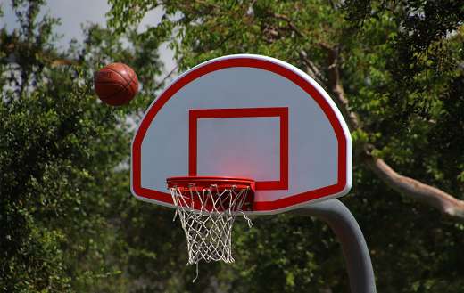 Ball near basketball hoop