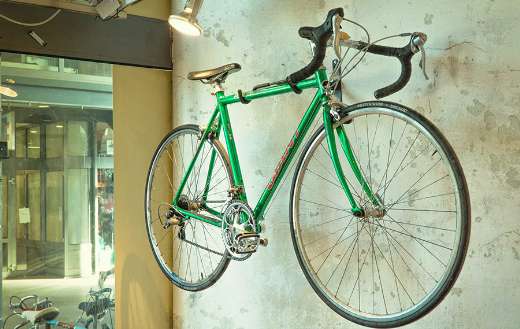 Hanged bicycle on wall online