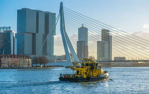 Yellow ship near bridge