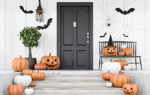 Carved pumpkins bats and spiders on stairs