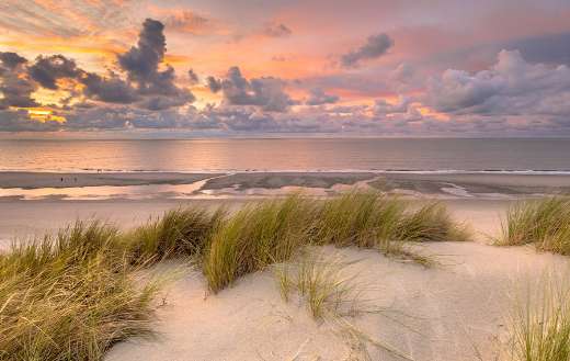 Sunset view North sea and canal Zeeland Netherlands