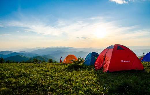 Dome tents overlooking mountain ranges