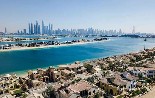 Villas in front of skyscapers in Dubai