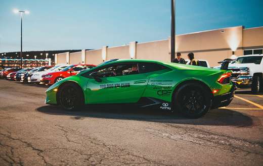 Green sports car on parking lot