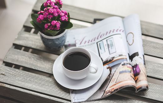 Black coffee reading magazine