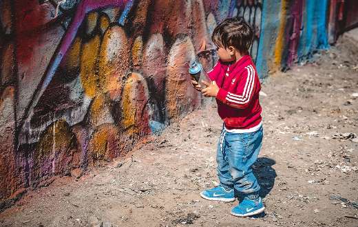Child with spray paint