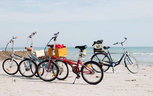 Four bicycles beach side
